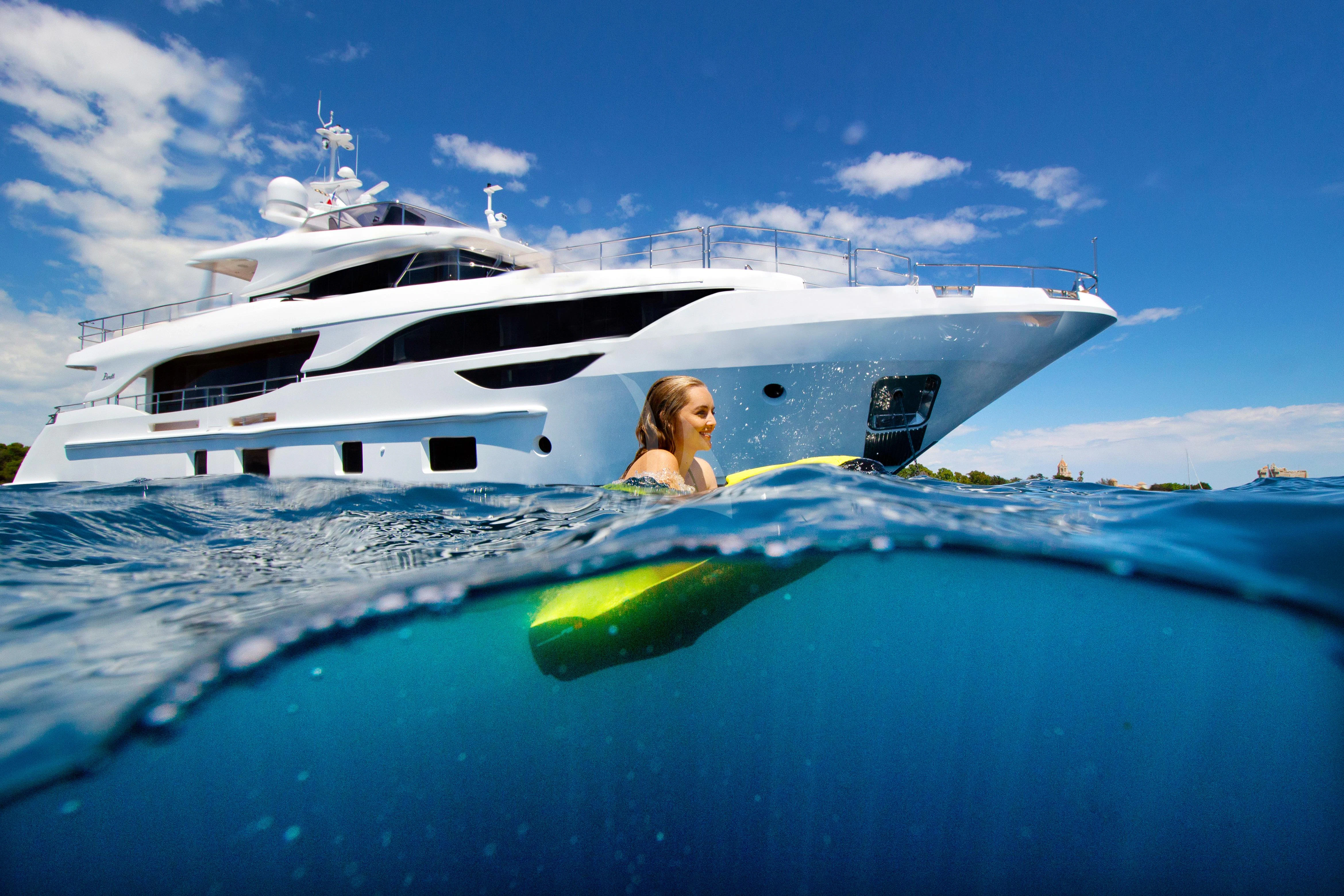 a person sitting on a boat aboard NAZ Yacht for Sale