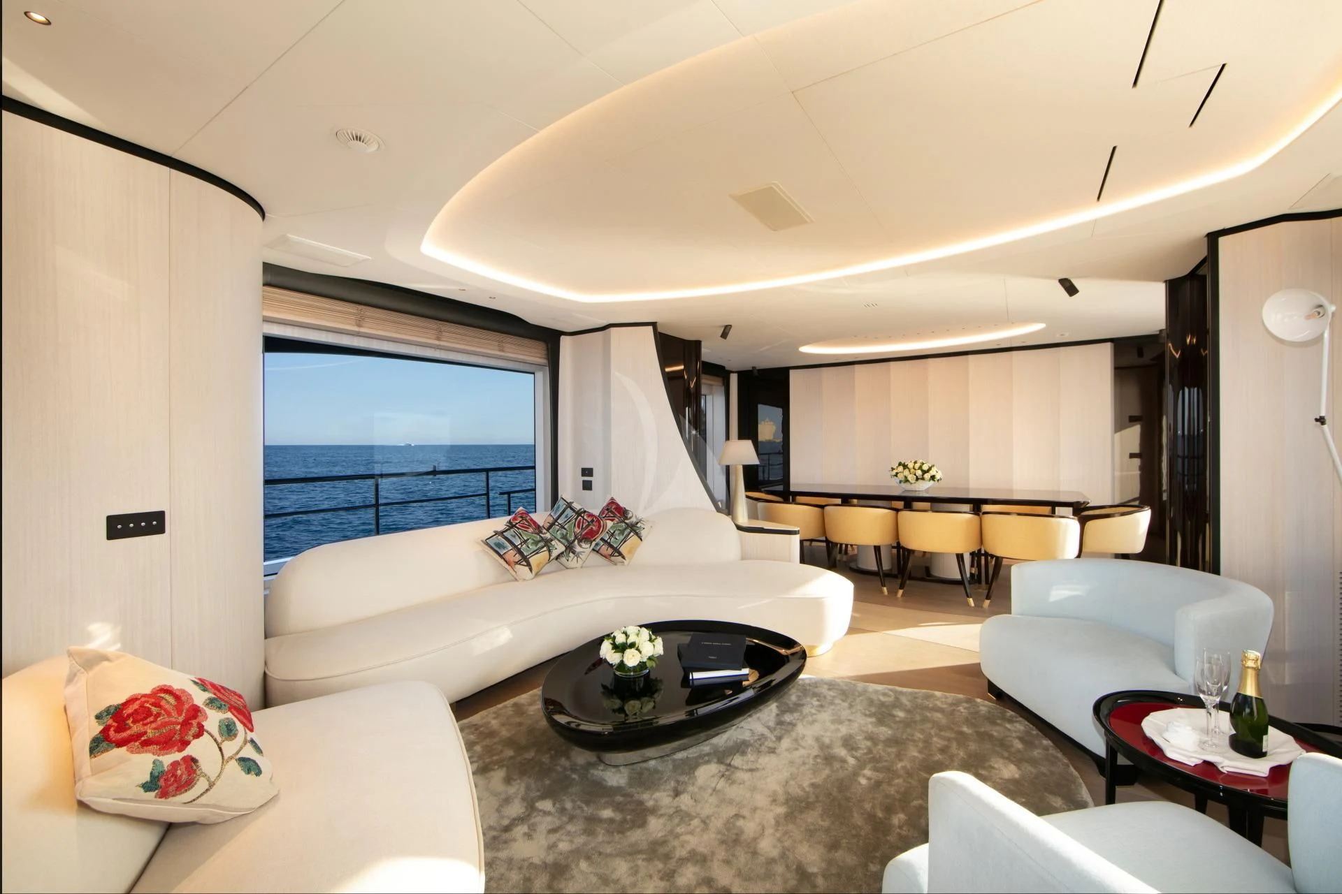 a living room with a large window aboard NAZ Yacht for Sale