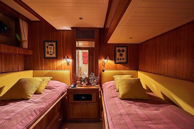 a room with two beds aboard ANAMCARA Yacht for Sale