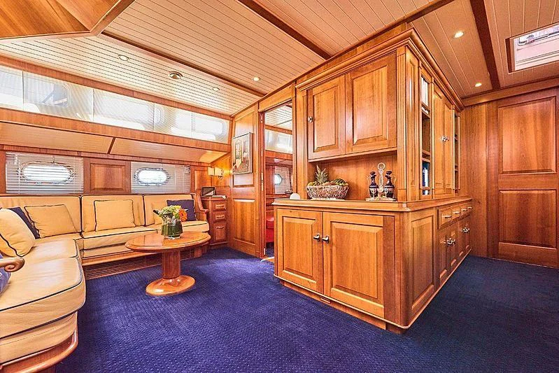 a room with a couch and a table aboard ANAMCARA Yacht for Sale