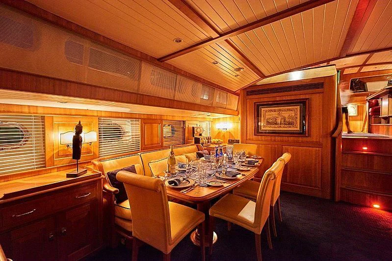 a dining room with a table and chairs aboard ANAMCARA Yacht for Sale