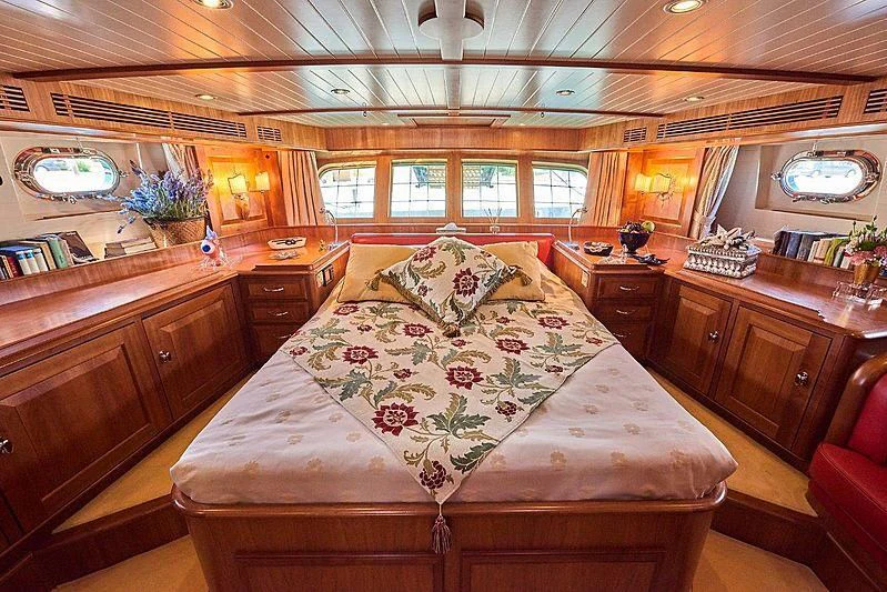 a bedroom with a large bed aboard ANAMCARA Yacht for Sale