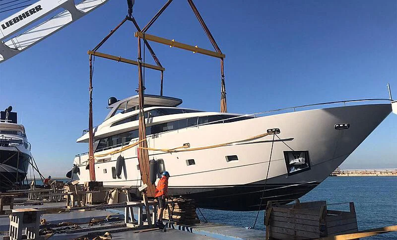 a boat docked at a pier aboard VACANOS Yacht for Sale