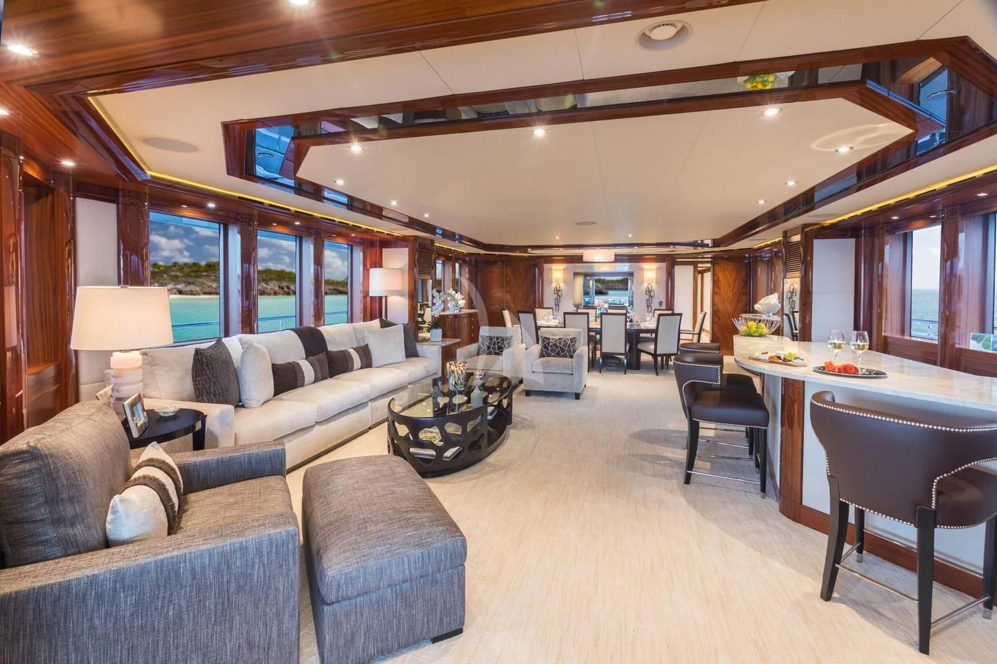 a living room with a couch and a table aboard CHASING DAYLIGHT Yacht for Sale