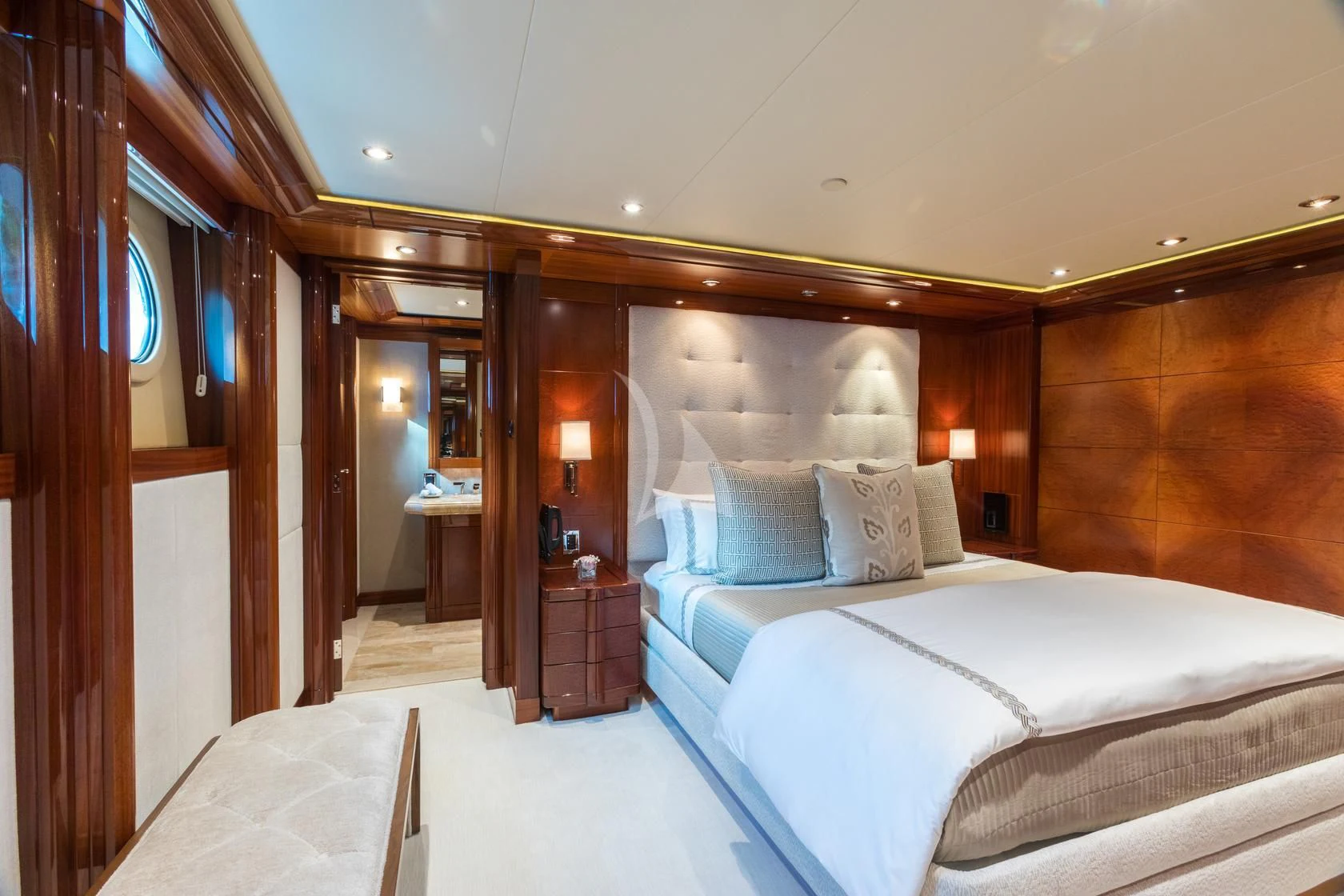 a room with a bed and a mirror aboard CHASING DAYLIGHT Yacht for Sale