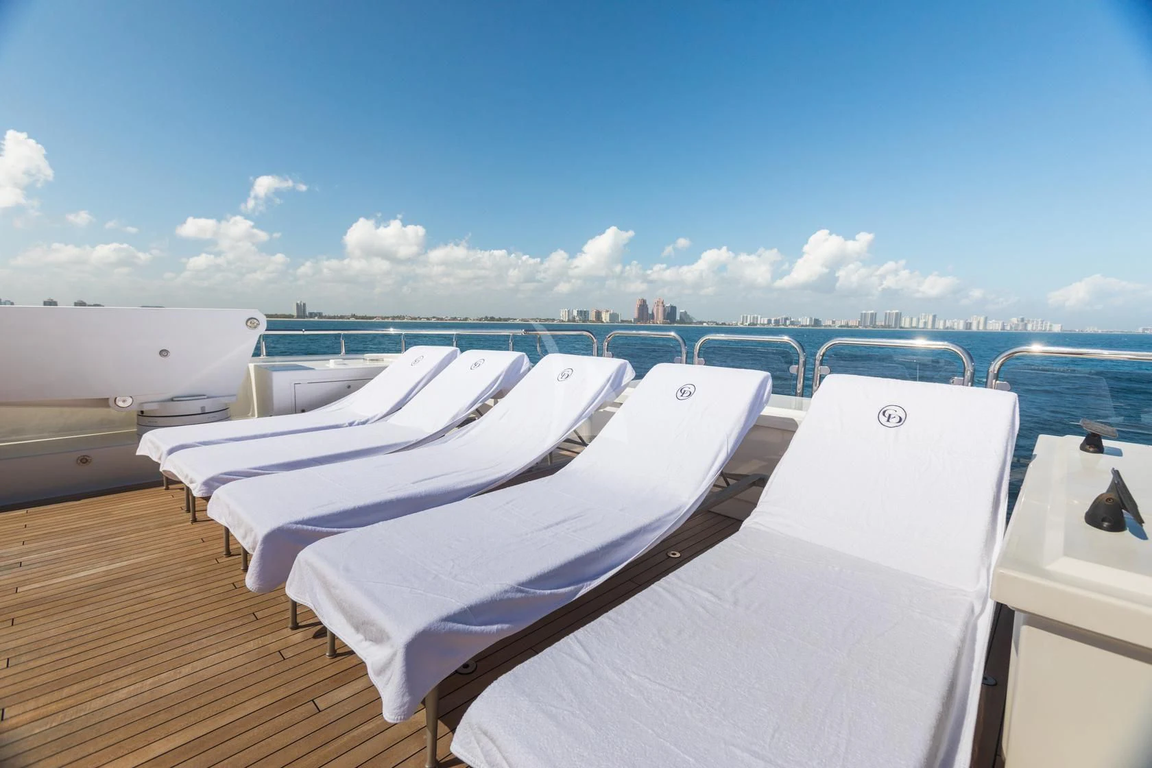 a deck with a view of a city and water aboard CHASING DAYLIGHT Yacht for Sale