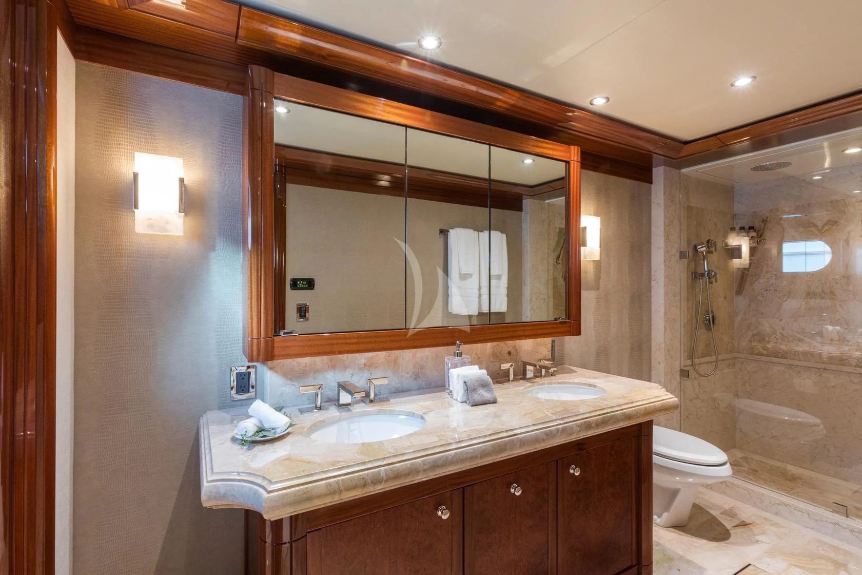 a bathroom with a large mirror aboard CHASING DAYLIGHT Yacht for Sale
