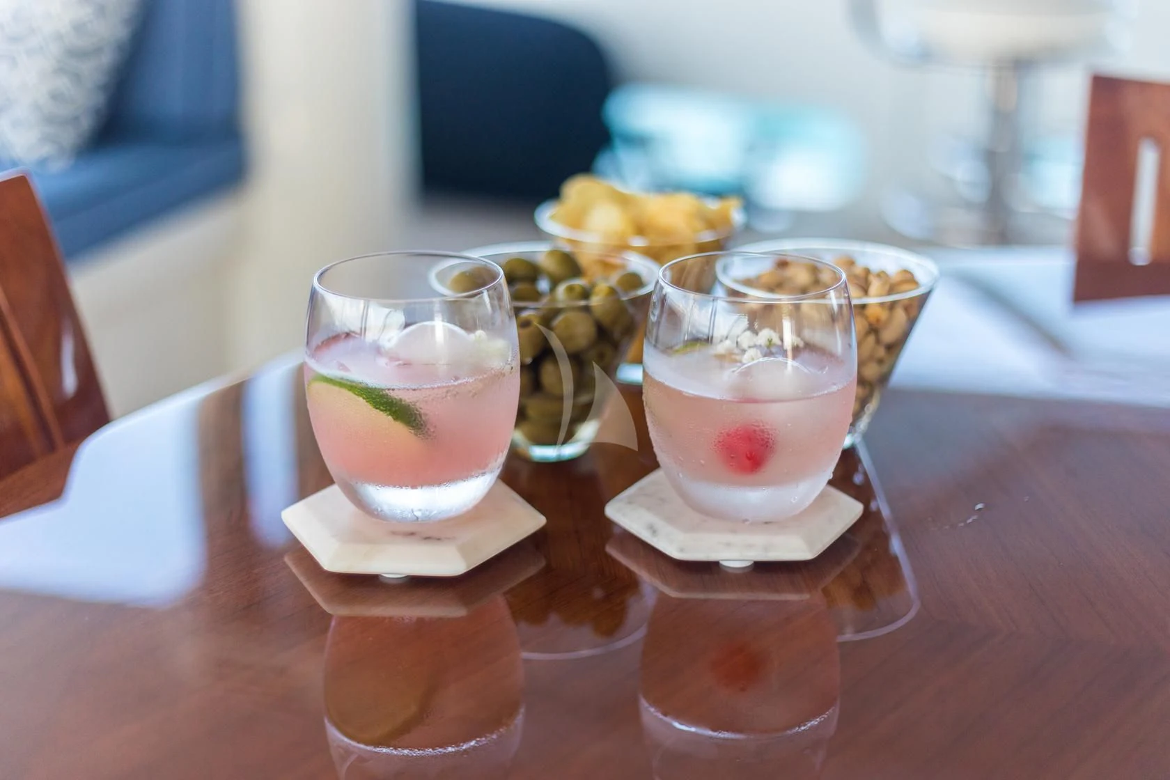 a group of glasses with drinks on a table aboard CHASING DAYLIGHT Yacht for Sale