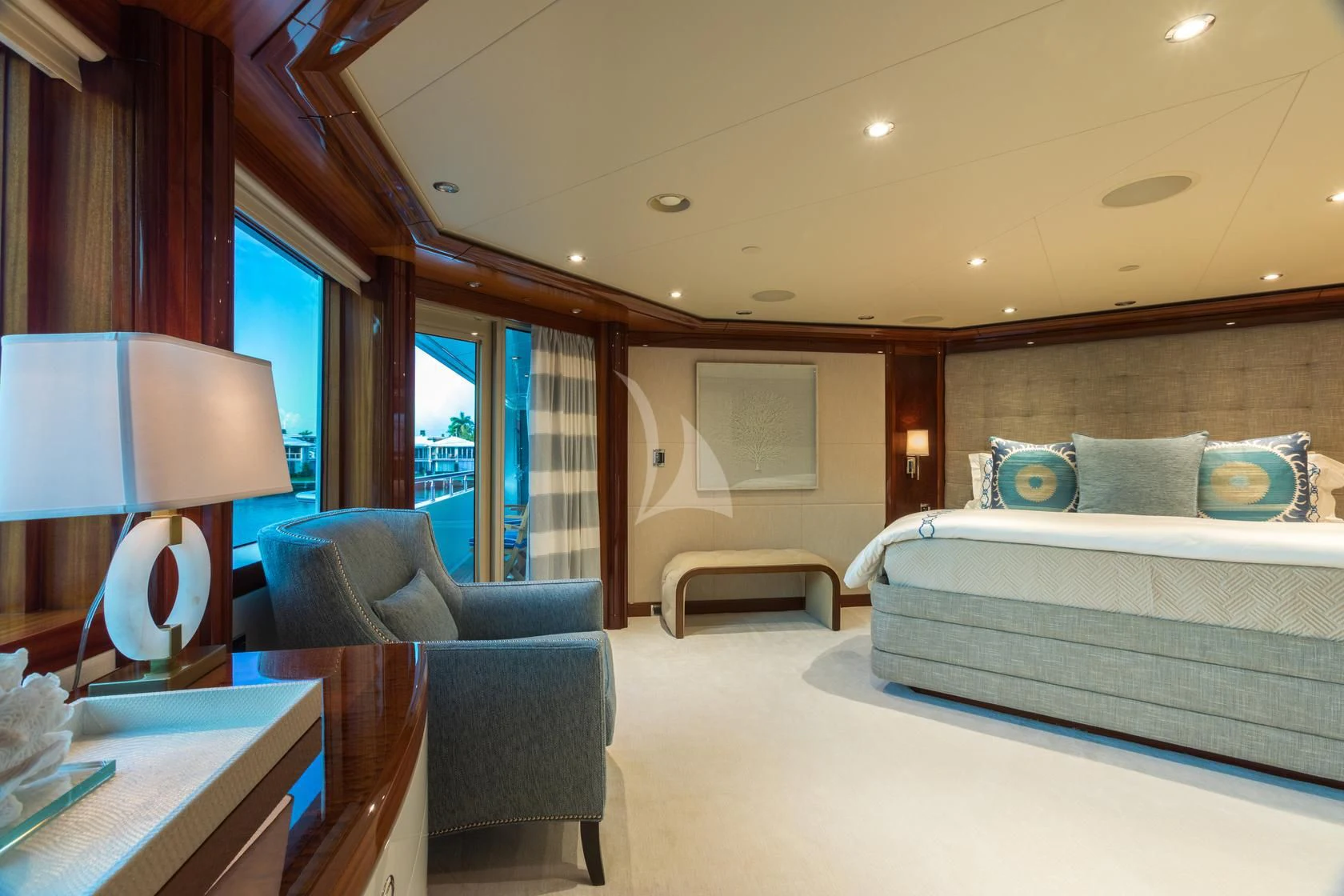 a bedroom with a bed and a couch aboard CHASING DAYLIGHT Yacht for Sale