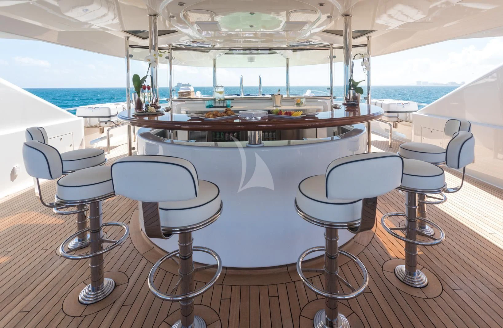 a table with chairs around it aboard CHASING DAYLIGHT Yacht for Sale