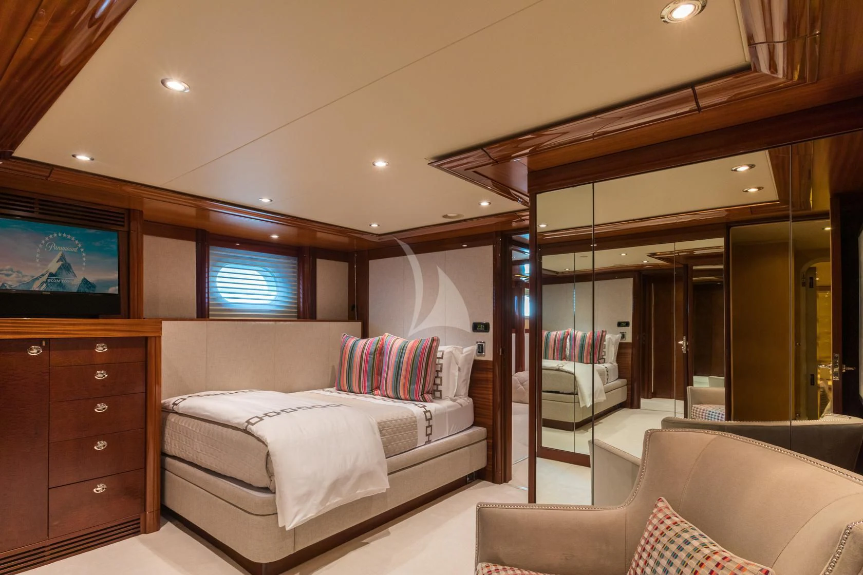 a room with a bed and a tv aboard CHASING DAYLIGHT Yacht for Sale