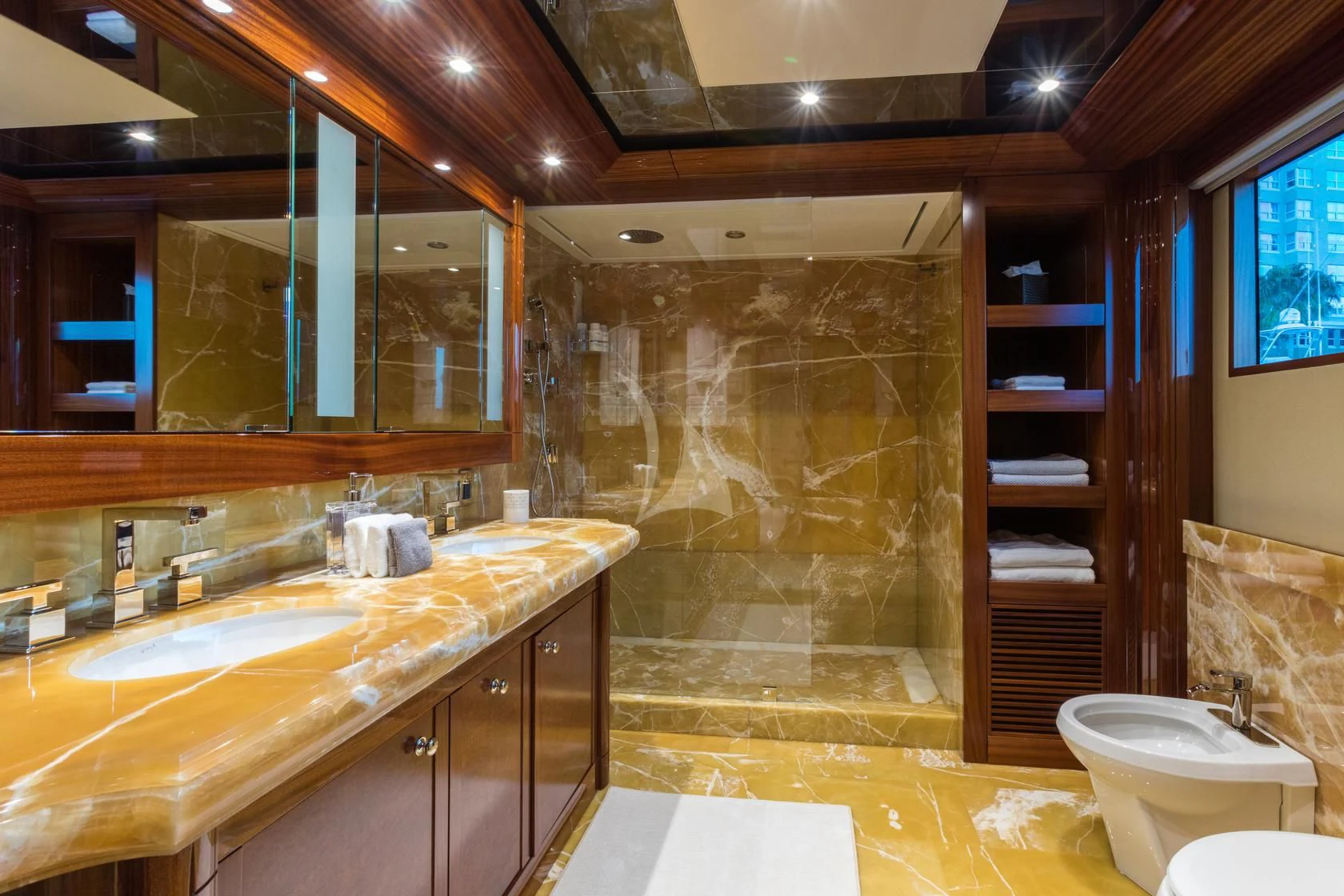 a bathroom with a large glass shower aboard CHASING DAYLIGHT Yacht for Sale