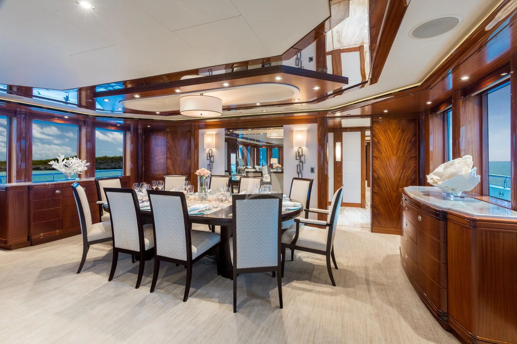 a room with a table and chairs aboard CHASING DAYLIGHT Yacht for Sale