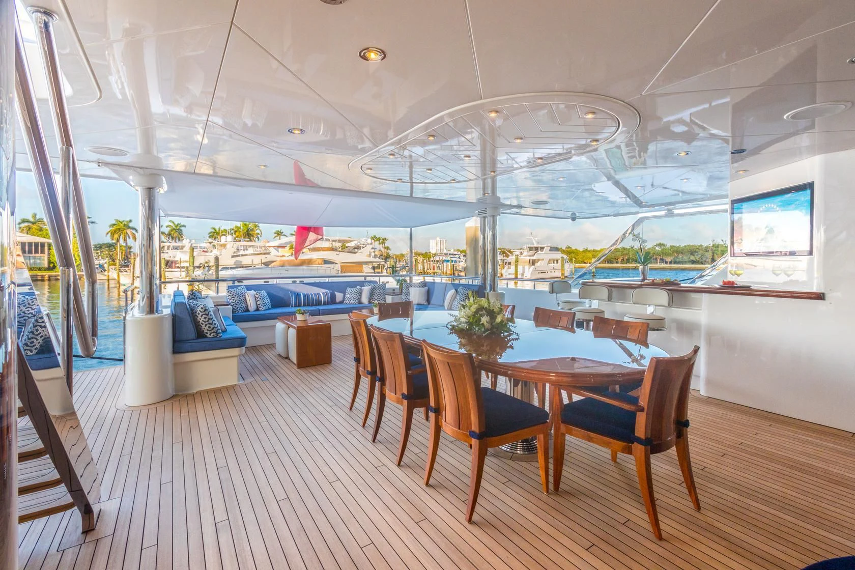 a large room with a table and chairs and a large glass ceiling aboard CHASING DAYLIGHT Yacht for Sale