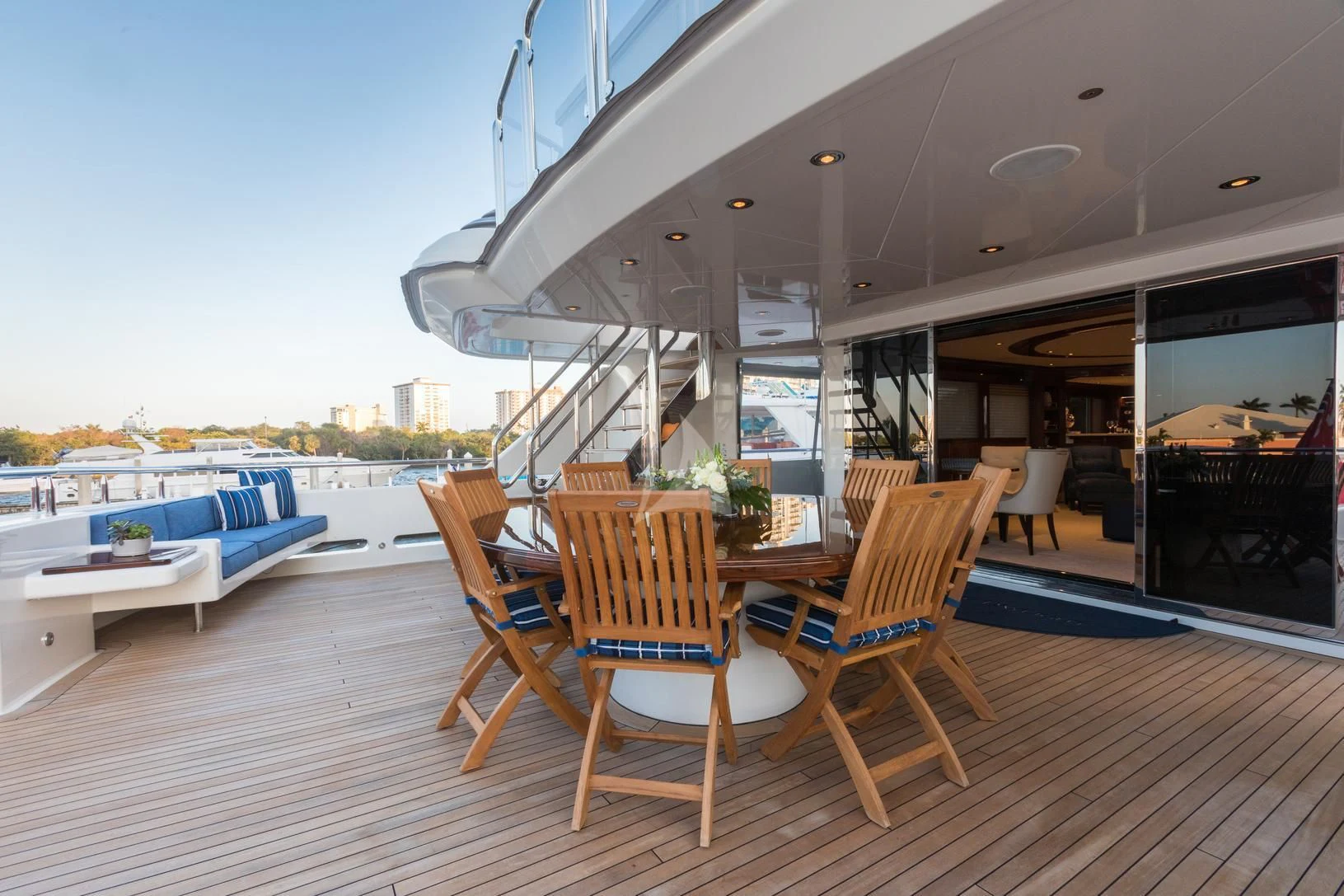 a deck with a table and chairs on it aboard CHASING DAYLIGHT Yacht for Sale
