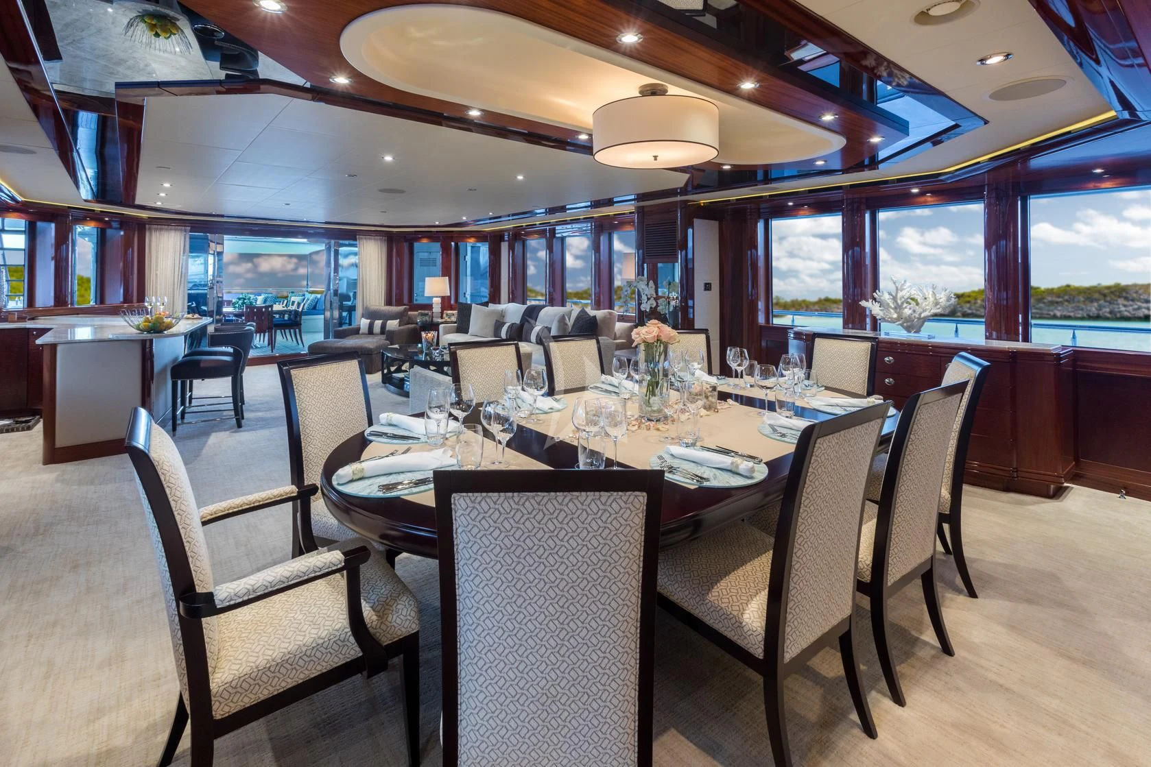 a large dining room with a table and chairs aboard CHASING DAYLIGHT Yacht for Sale