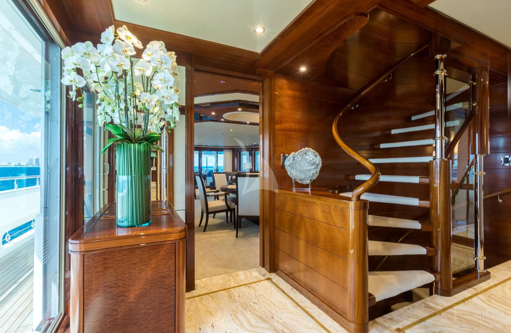 a staircase with a vase of flowers aboard CHASING DAYLIGHT Yacht for Sale