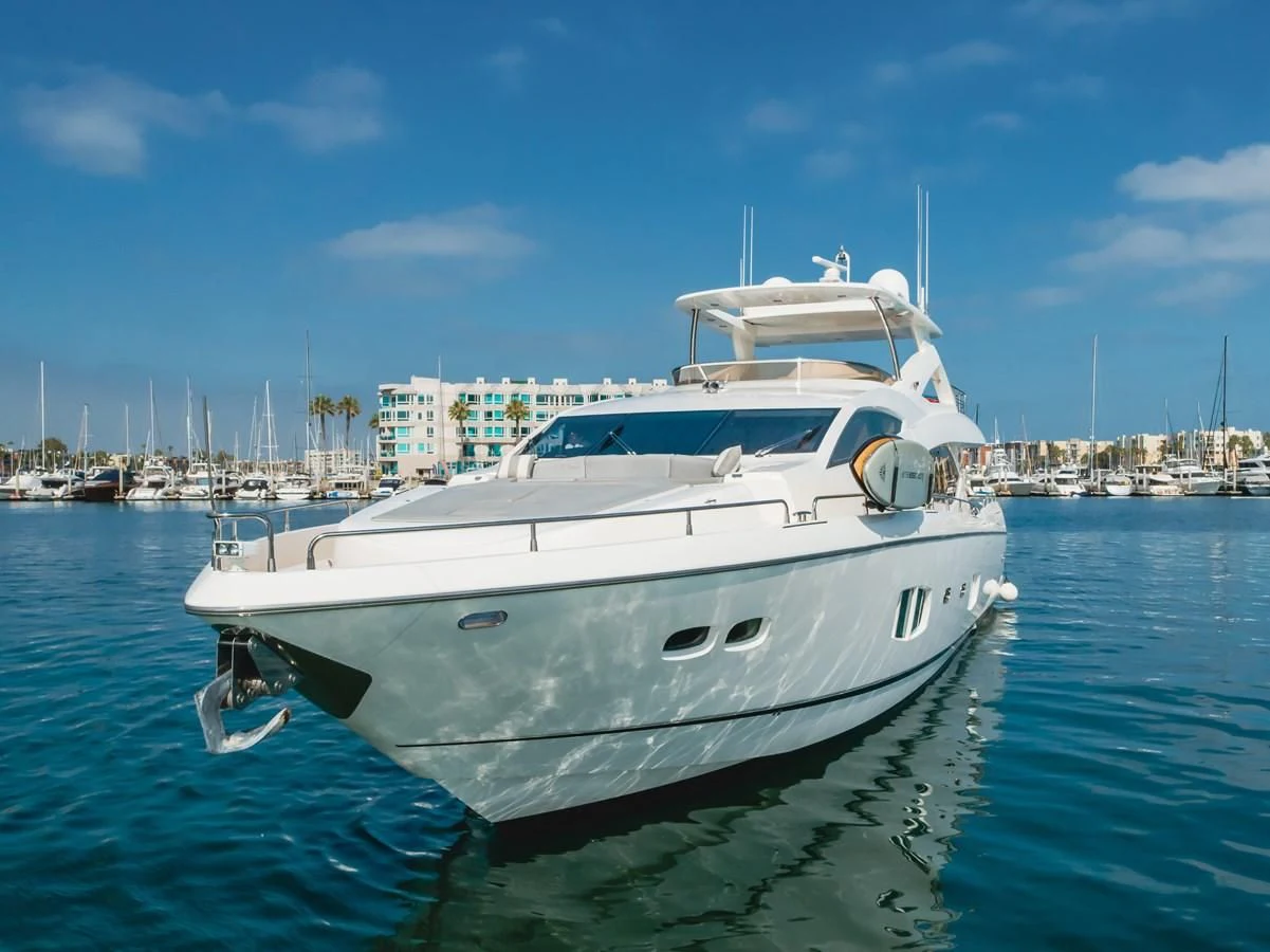a white yacht in the water aboard INDECENT PROPOSAL 4 Yacht for Sale