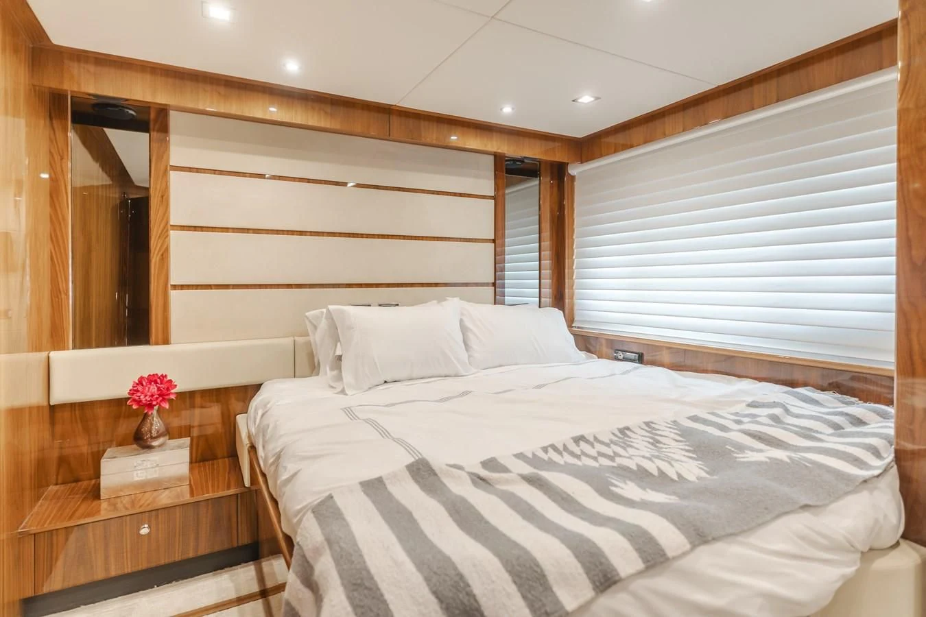 a bed with white sheets aboard INDECENT PROPOSAL 4 Yacht for Sale