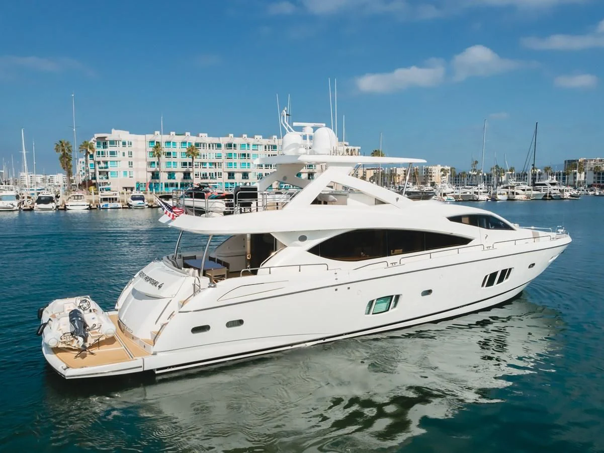 a white yacht in the water aboard INDECENT PROPOSAL 4 Yacht for Sale