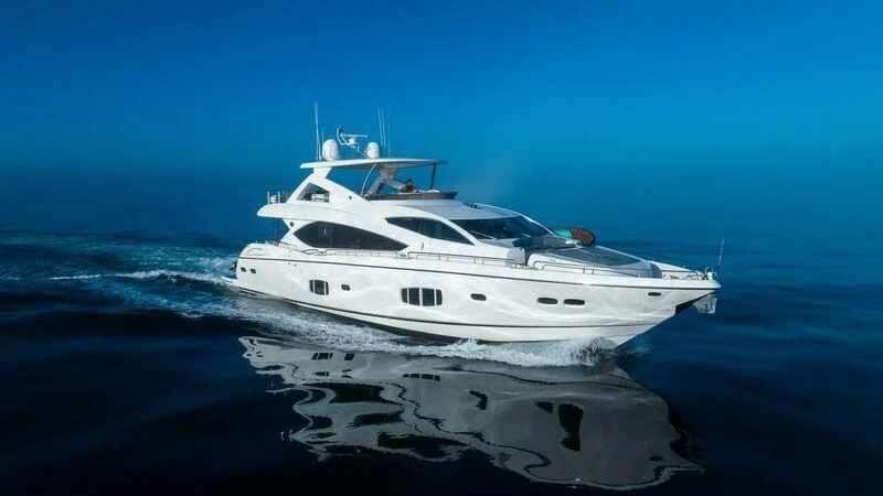 a white yacht on the water aboard INDECENT PROPOSAL 4 Yacht for Sale