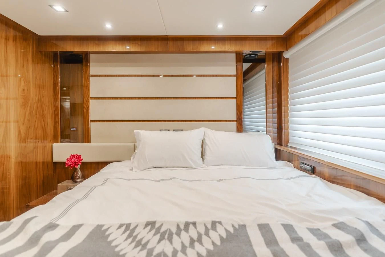 a bed with white sheets aboard INDECENT PROPOSAL 4 Yacht for Sale