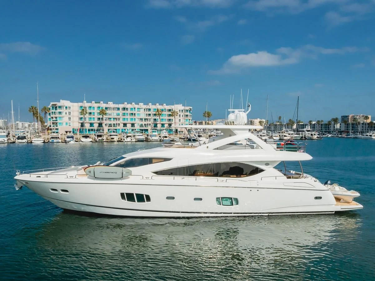a white yacht in the water aboard INDECENT PROPOSAL 4 Yacht for Sale