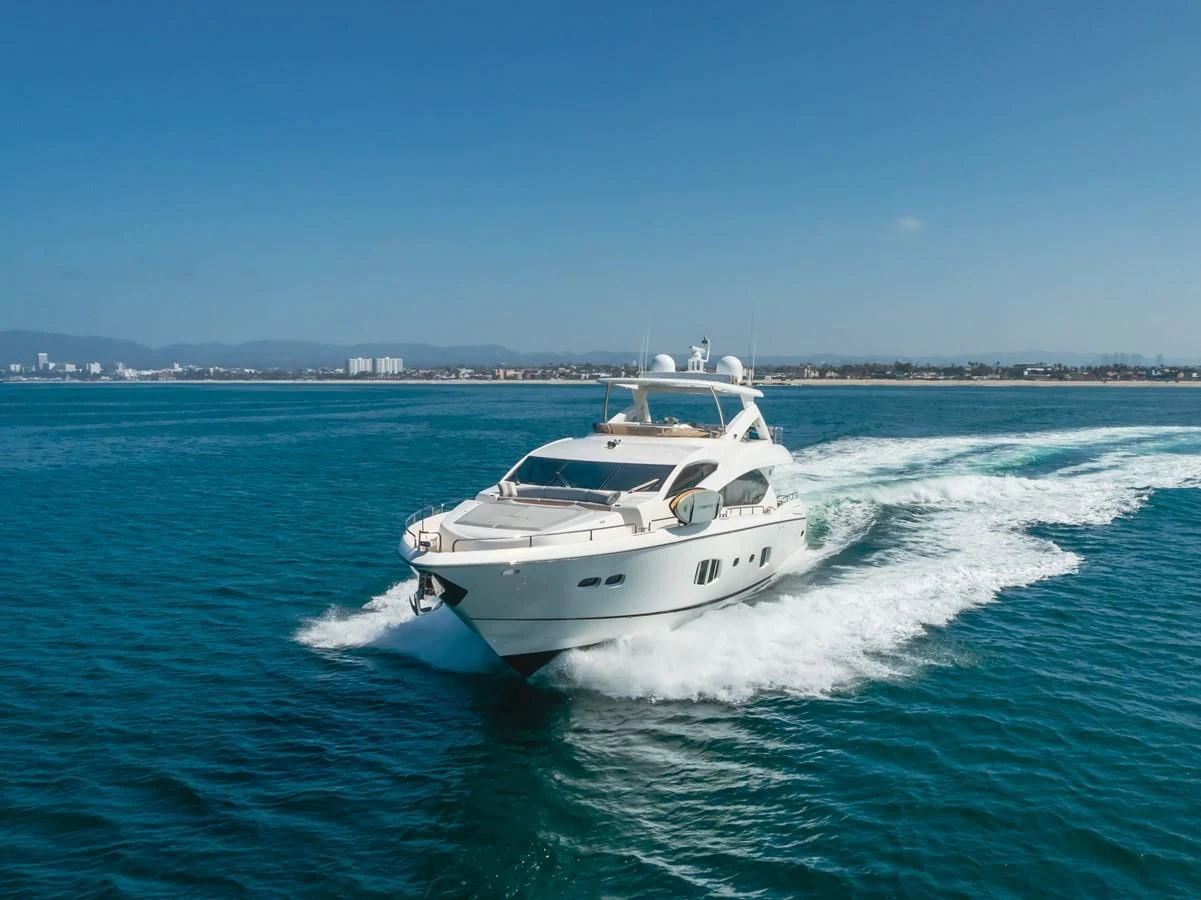 a white boat on the water aboard INDECENT PROPOSAL 4 Yacht for Sale