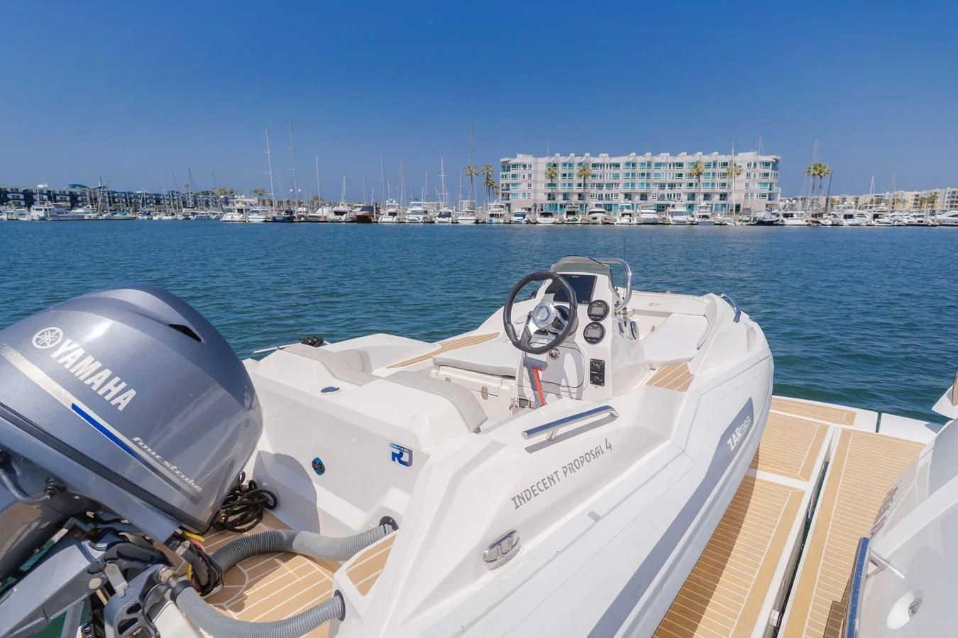 a boat with a steering wheel aboard INDECENT PROPOSAL 4 Yacht for Sale