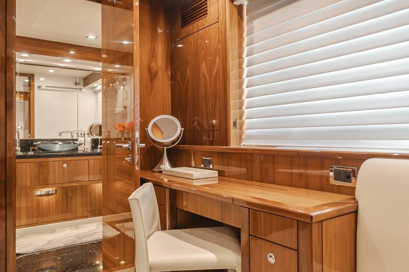 a bathroom with a sink and a mirror aboard INDECENT PROPOSAL 4 Yacht for Sale