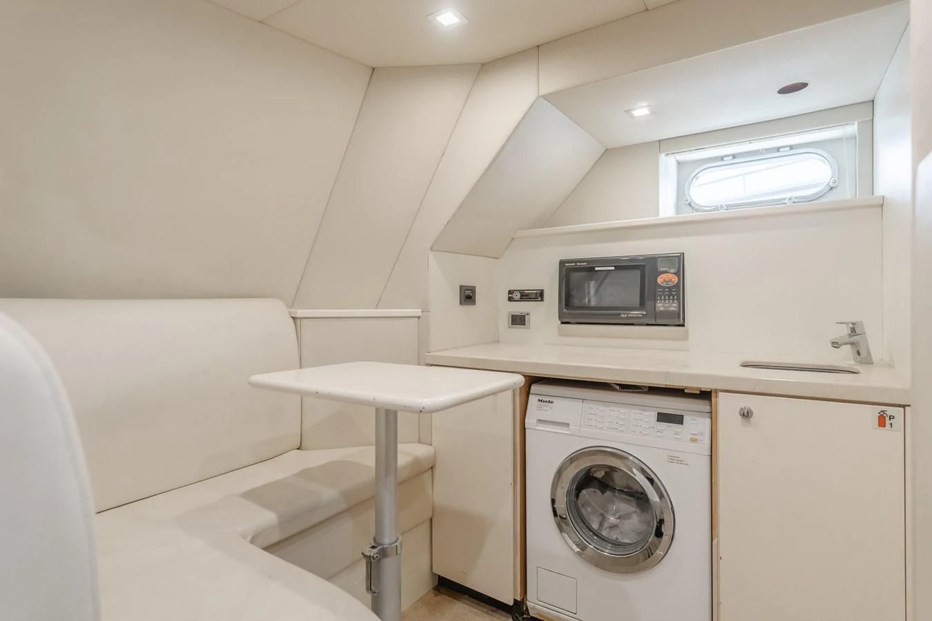 a small white kitchen aboard INDECENT PROPOSAL 4 Yacht for Sale