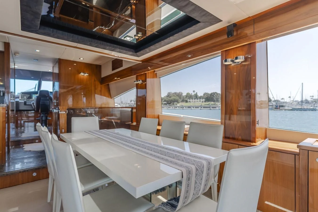 a room with a table and chairs aboard INDECENT PROPOSAL 4 Yacht for Sale