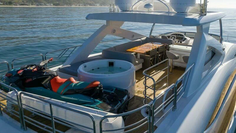 a boat with a person on it aboard INDECENT PROPOSAL 4 Yacht for Sale