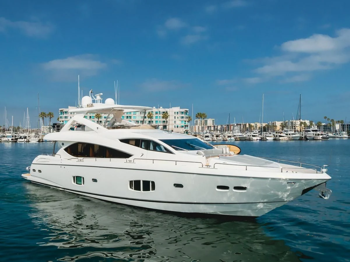 a white yacht in the water aboard INDECENT PROPOSAL 4 Yacht for Sale
