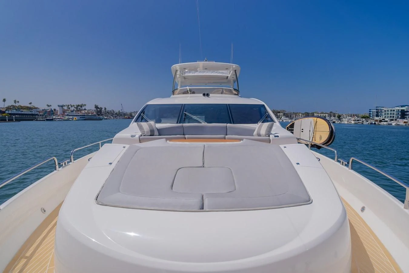 a white boat on a body of water aboard INDECENT PROPOSAL 4 Yacht for Sale
