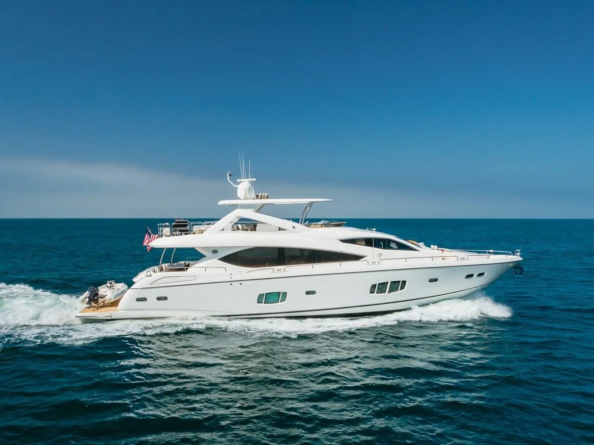 a white yacht on the water aboard INDECENT PROPOSAL 4 Yacht for Sale