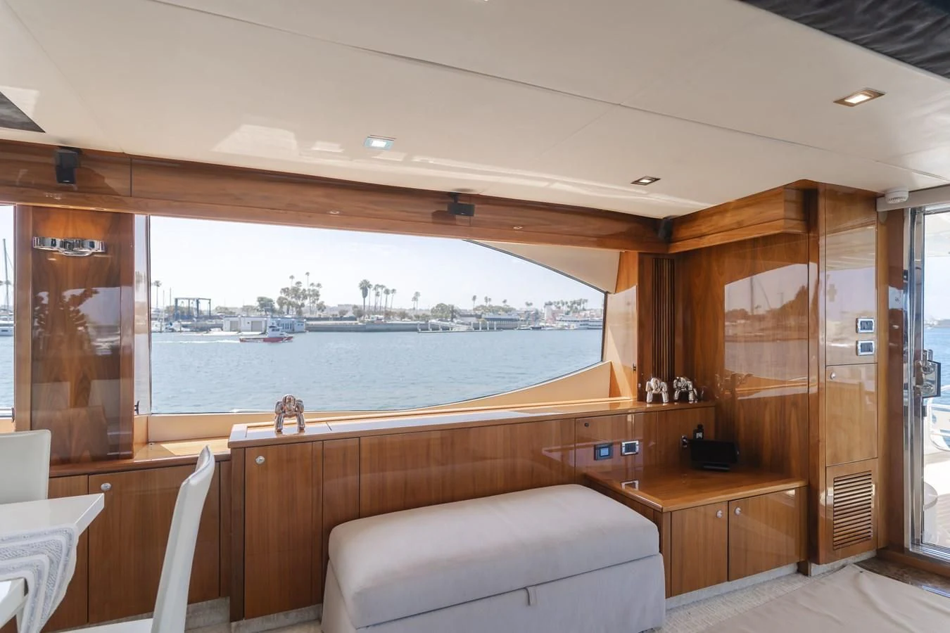 a room with a view of a city and water aboard INDECENT PROPOSAL 4 Yacht for Sale