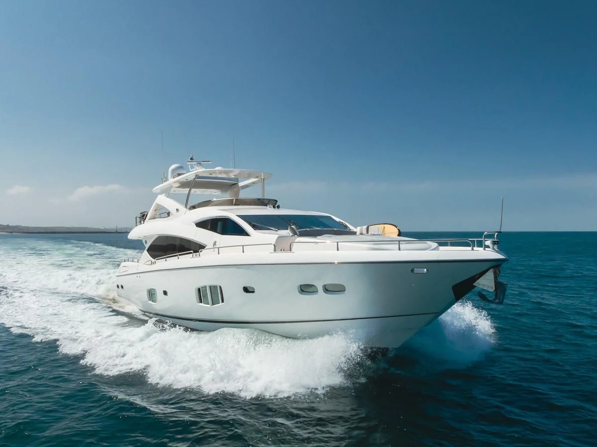 a white yacht on the water aboard INDECENT PROPOSAL 4 Yacht for Sale