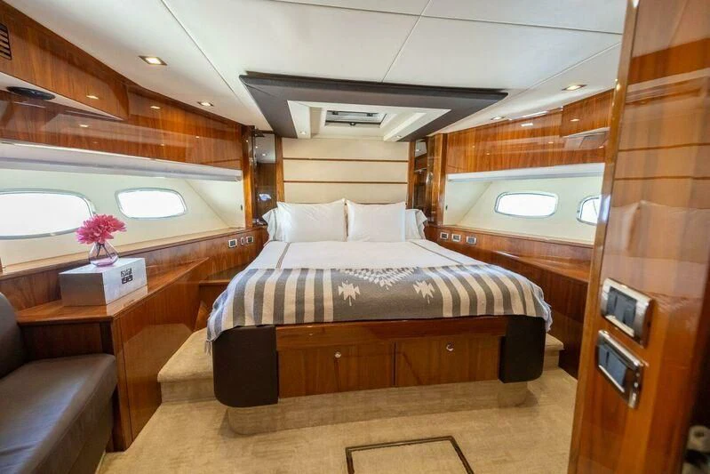 a cabin with a bed aboard INDECENT PROPOSAL 4 Yacht for Sale