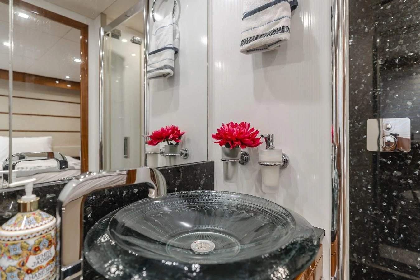 a bathroom with a sink and toilet aboard INDECENT PROPOSAL 4 Yacht for Sale