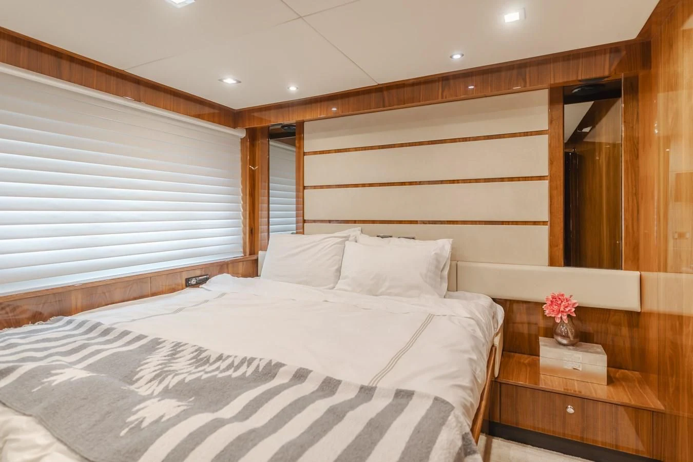 a bed with white sheets aboard INDECENT PROPOSAL 4 Yacht for Sale