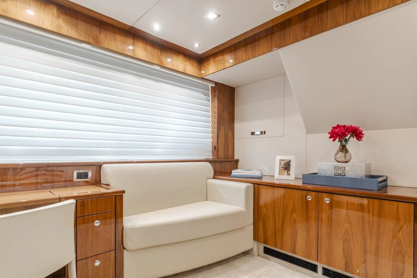 a room with a couch and a table aboard INDECENT PROPOSAL 4 Yacht for Sale