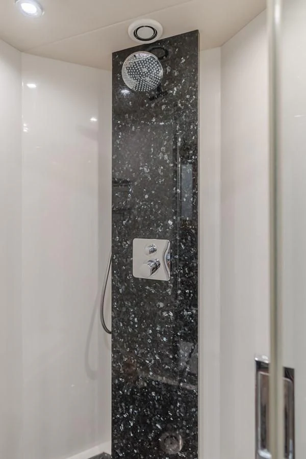 a wall with a shower head aboard INDECENT PROPOSAL 4 Yacht for Sale