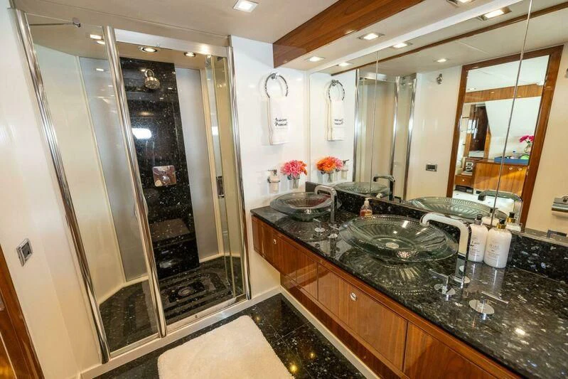a bathroom with a marble counter top aboard INDECENT PROPOSAL 4 Yacht for Sale