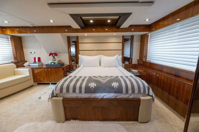 a bed in a room aboard INDECENT PROPOSAL 4 Yacht for Sale