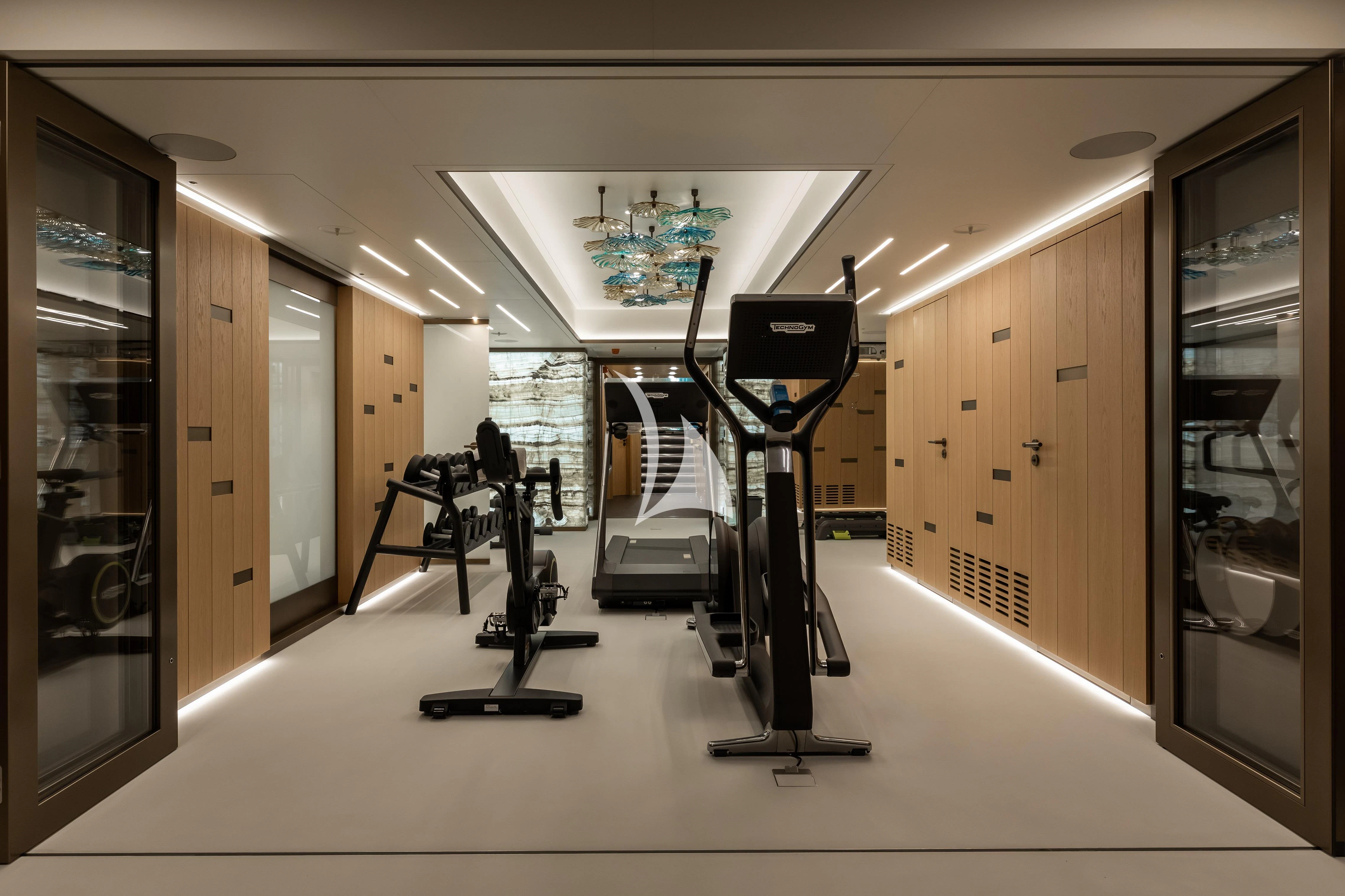 a gym with exercise equipment aboard LA DATCHA Yacht for Sale