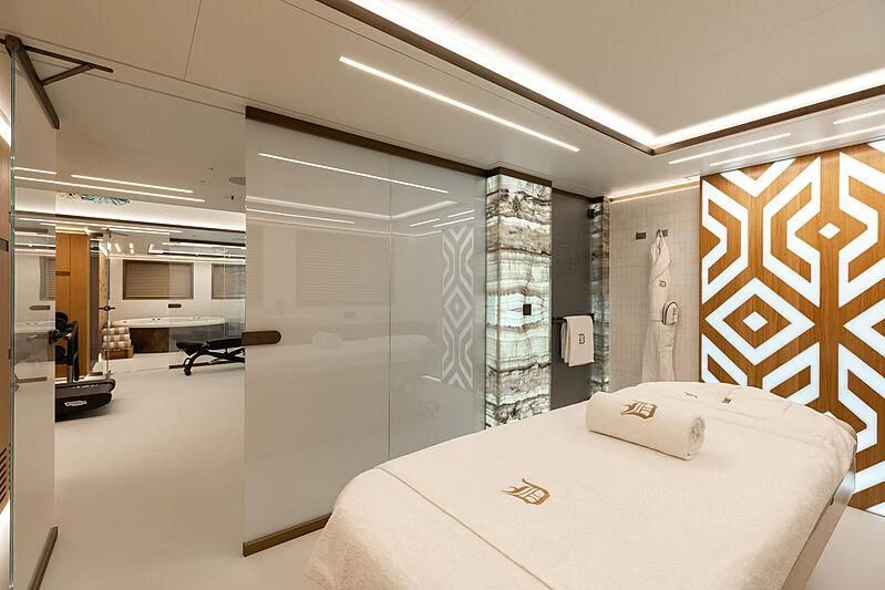 a room with a bed and a wall of glass aboard LA DATCHA Yacht for Sale