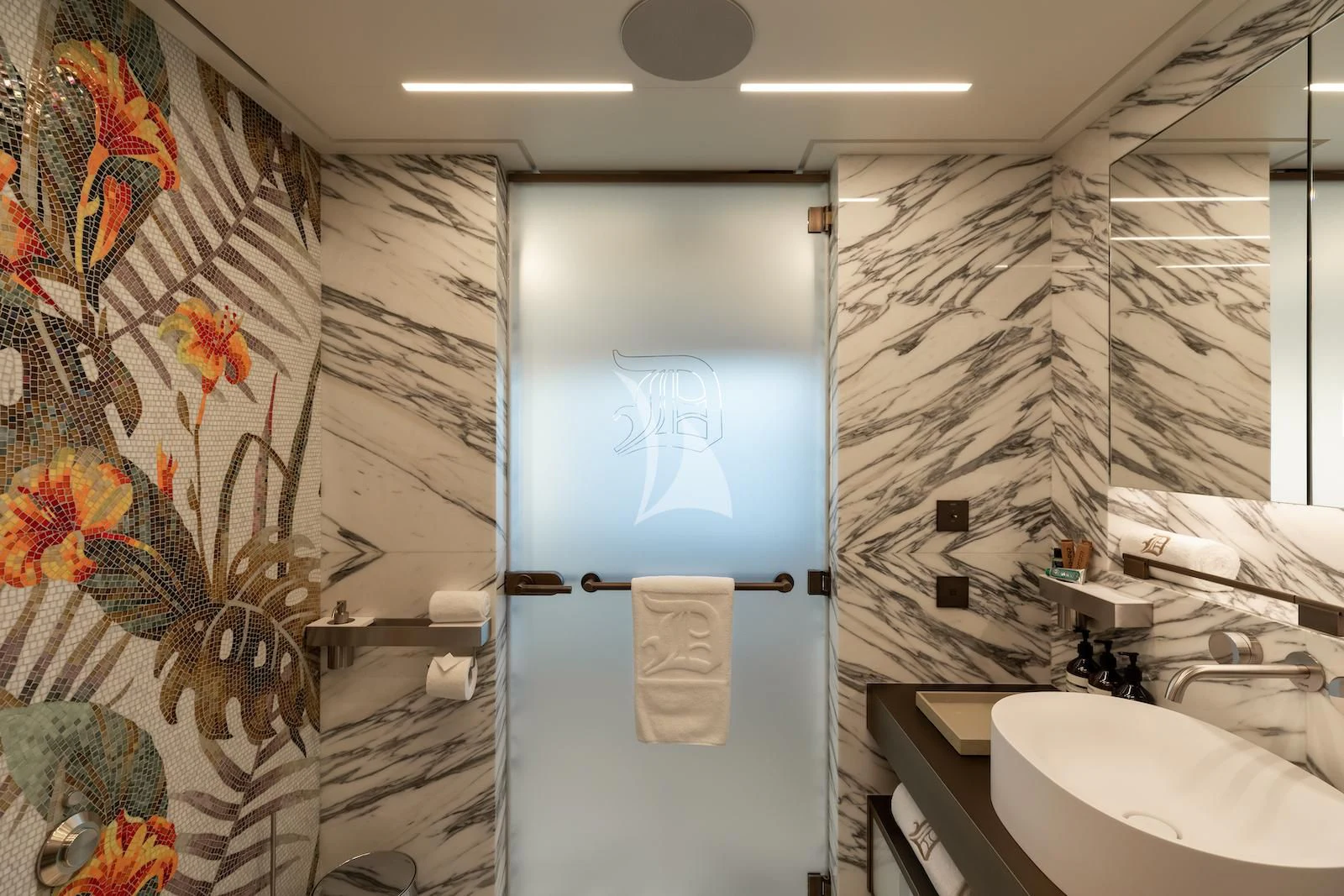 a bathroom with a sink and a mirror aboard LA DATCHA Yacht for Sale