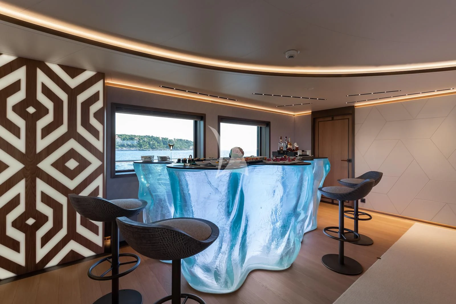 a room with a table and chairs aboard LA DATCHA Yacht for Sale