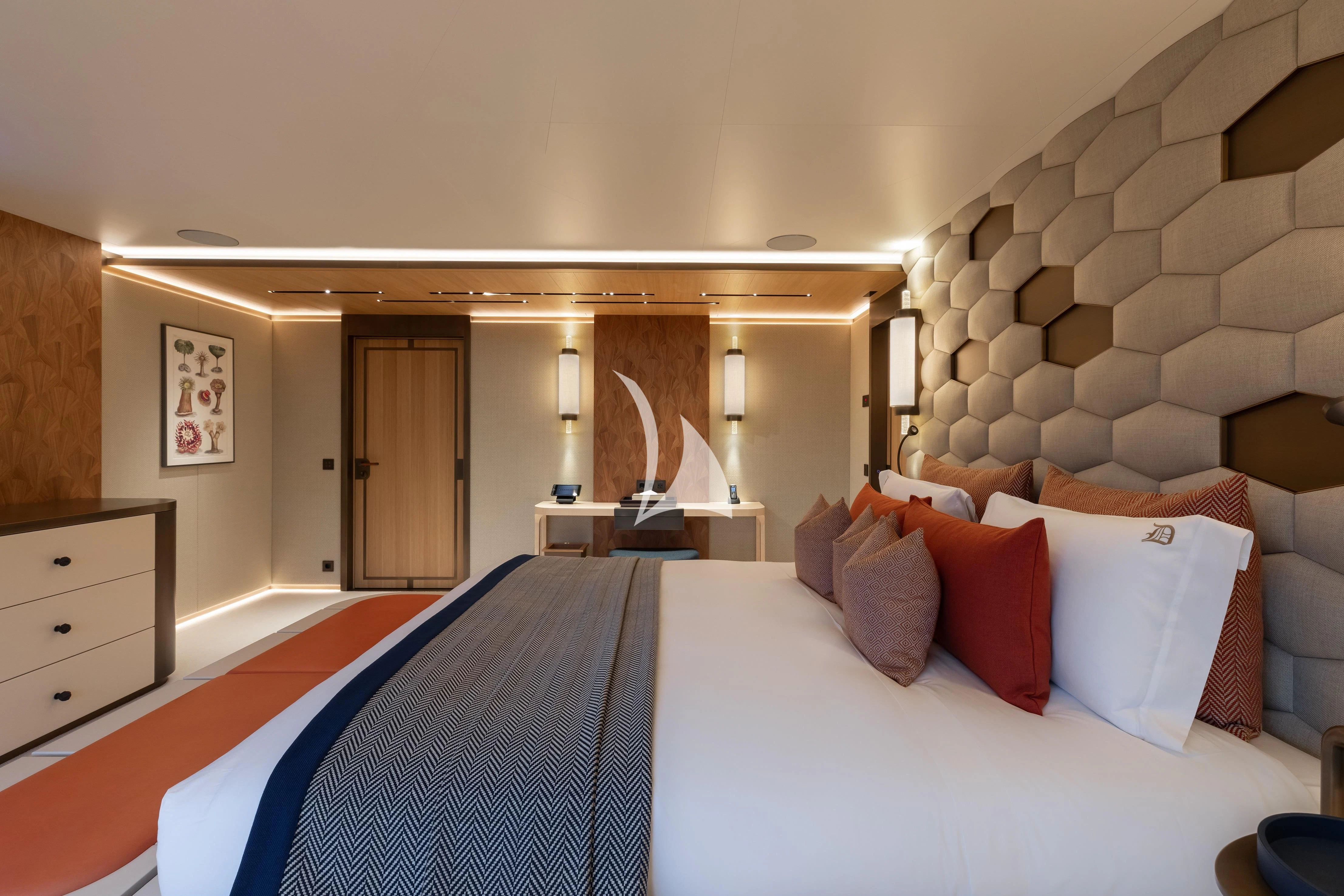 a large bed in a room aboard LA DATCHA Yacht for Sale